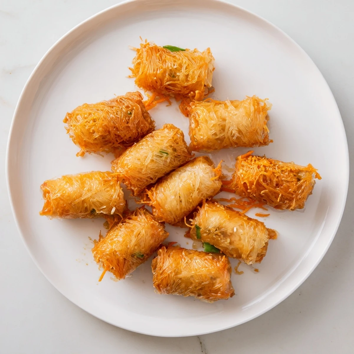 Delicious, homemade chicken lumpia bites – a simple appetizer with an inviting, crunchy appeal.