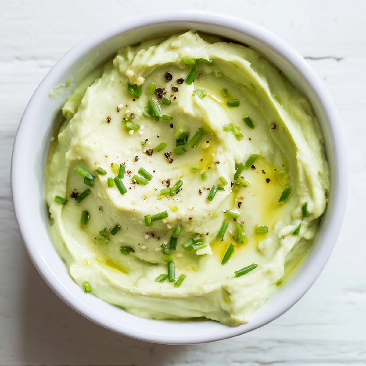 Creamy Avocado Cottage Cheese Dip, a vibrant green dip ready to be scooped up with fresh vegetables.