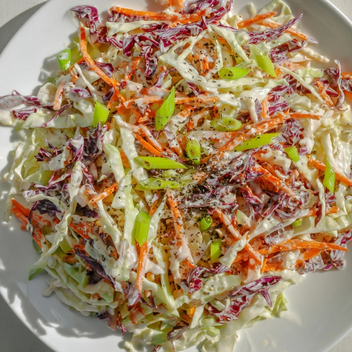 Quick Coleslaw Salad with creamy dressing, a vibrant medley of shredded cabbage and carrots.