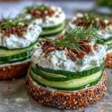Creamy, tangy viral cucumber salad topped with crunchy everything bagel seasoning for snacking.