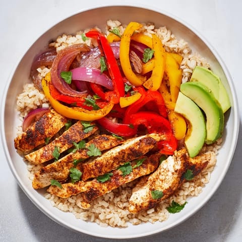 Make-Ahead Chicken Fajita Meal Prep Bowls feature tender chicken, colorful peppers, and rice; a flavorful, healthy meal.