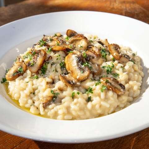 Steaming bowl of stove-top creamy risotto, a comforting Italian rice dish with Parmesan flavor.