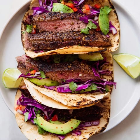 Savory Coffee-Rubbed Steak Tacos, showcasing tender grilled steak atop colorful, flavorful taco ingredients.
