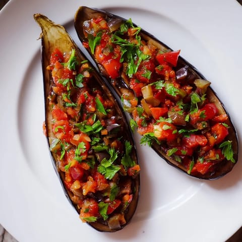 Enjoy a close-up of the delicious Imam Bayildi, the fragrant Turkish eggplant dish ready to devour.