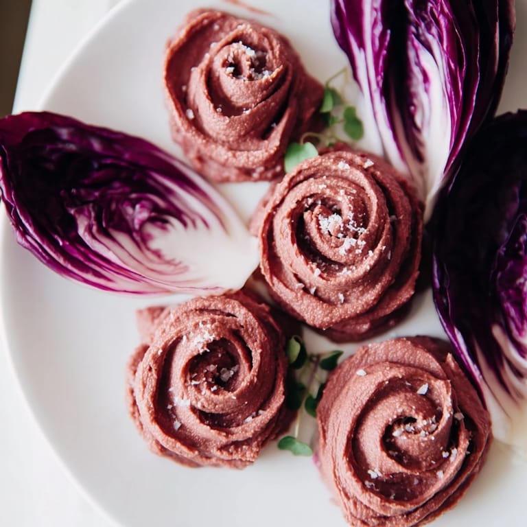 The richly colored and creamy "The Velvet Rose" features elegant, edible beet hummus flowers.